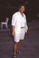 Queen Latifah photo print at Fox Affiliates Party, tan shorts and vest.