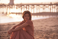 Susan Ward sitting on beach at sunset photo print