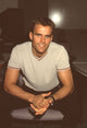 Cameron Mathison leaning forward in tan shirt photo print.