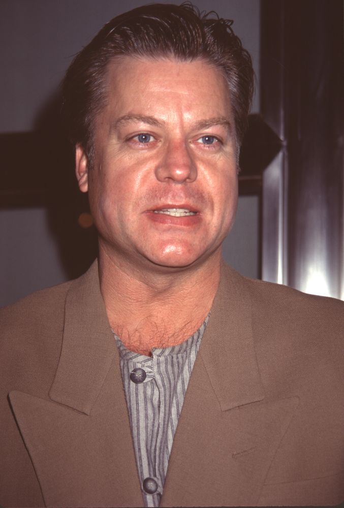 Brad Maule close up photo print from ABC Pre-Emmy Party in a brown jacket with striped shirt.