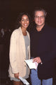 Felicia Bell in gray dress and tan blazer with Brad Maule in jeans and black blazer photo print