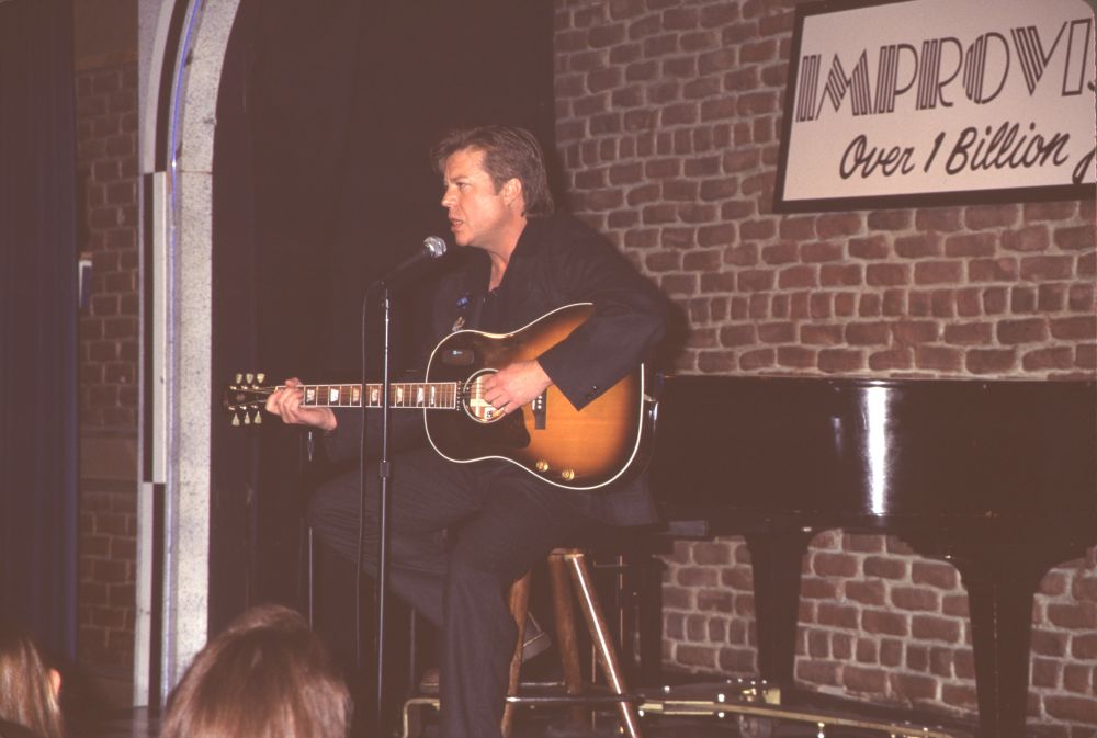 Brad Maule performing on stage with guitar photo print