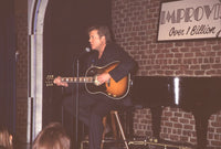 Brad Maule performing on stage with guitar photo print