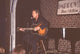 Brad Maule performing on stage with guitar photo print