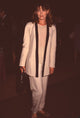 Joanna Pacula in cream suit with black trim photo print