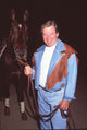 William Shatner photo print in denim outfit holding a horse