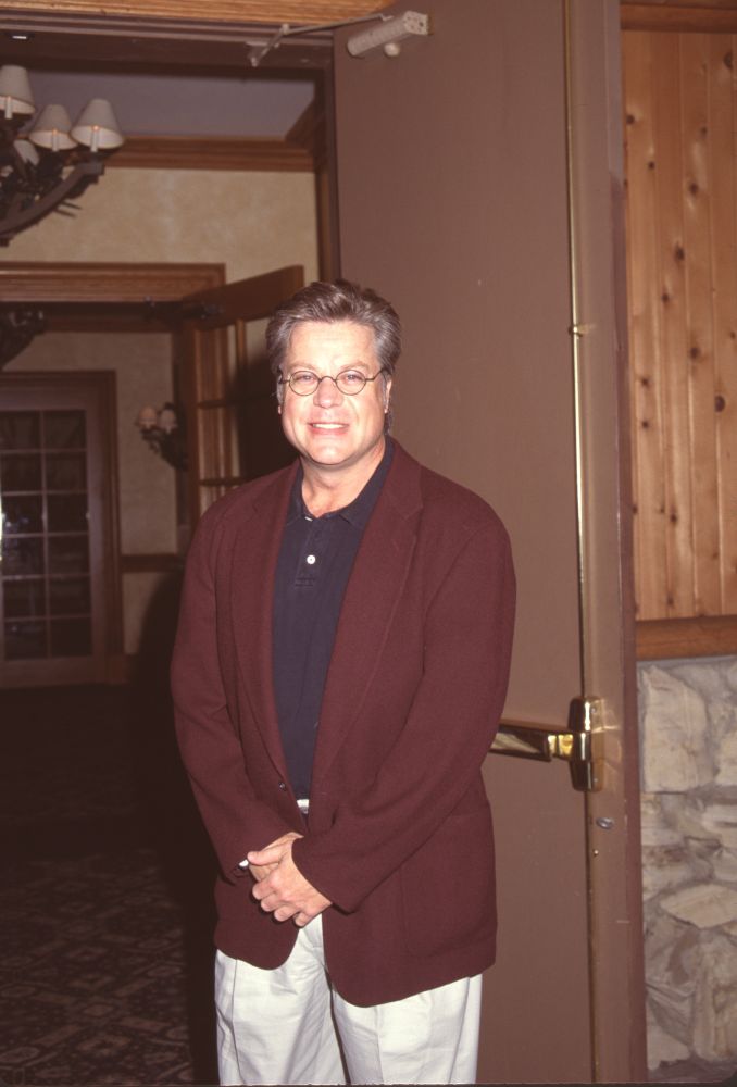 Brad Maule photo print in khakis and maroon blazer, stylish decor