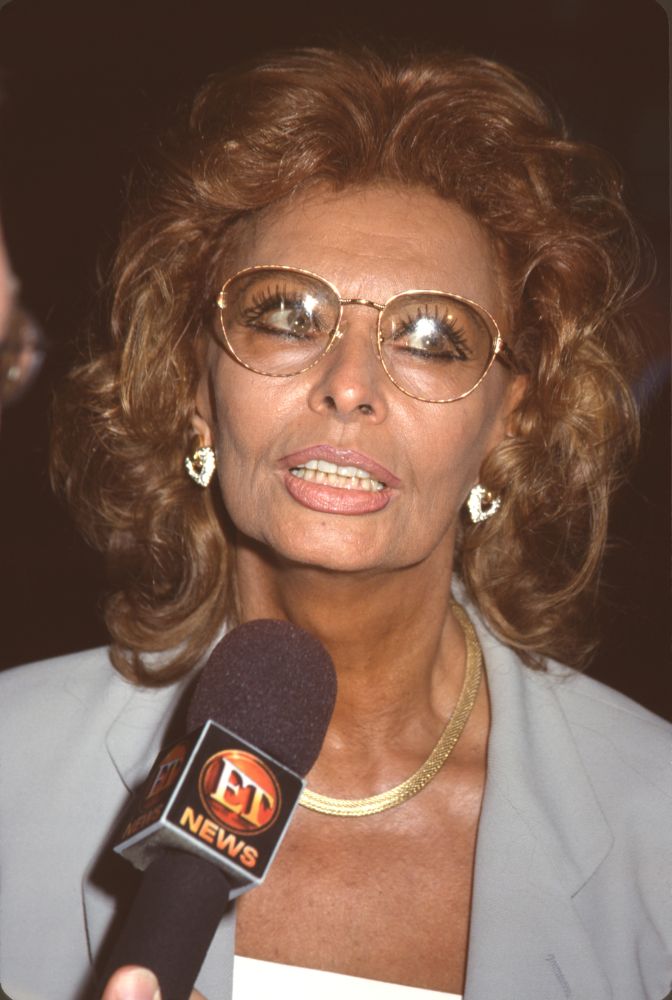 Sophia Loren being interviewed by ET News wearing gold glasses photo print.
