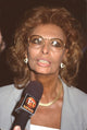 Sophia Loren being interviewed by ET News wearing gold glasses photo print.
