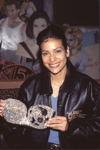 Constance Marie photo print in bedazzled bra and Planet Hollywood jacket.