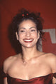 Constance Marie closeup photo print from the 1999 Alma Awards in red off-shoulder dress with flowers in hair.