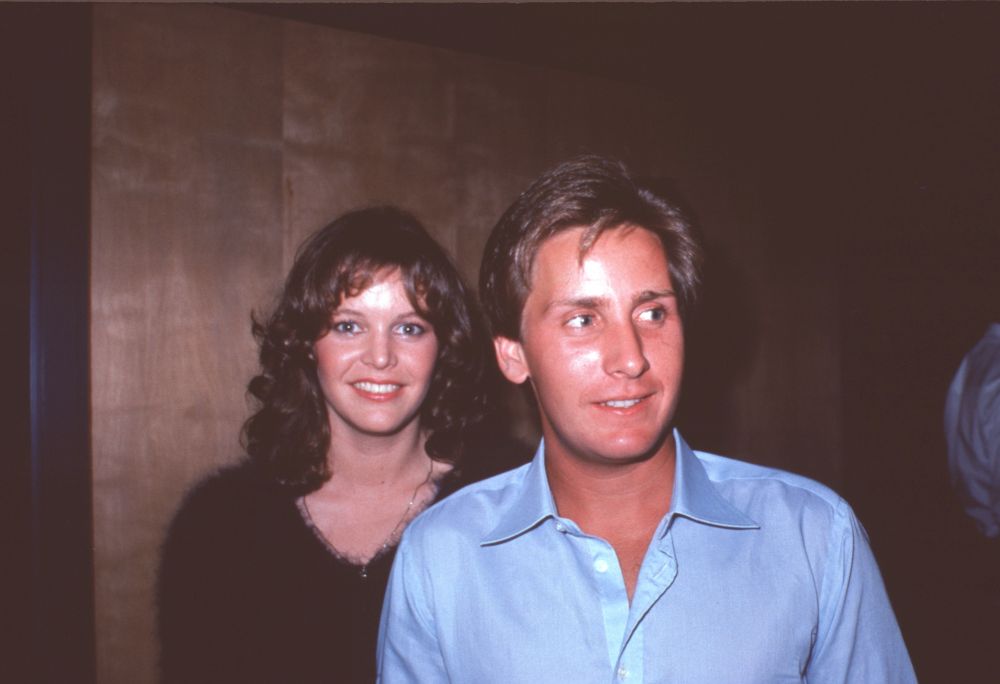 Carey Salley in black and Emilio Estevez in blue photo print.