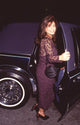Paula Abdul photo print getting into a limo in maroon lace outfit.
