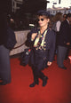Paula Abdul wearing a black skirt and cropped jacket with sunglasses - Photo Print