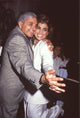 Harry Abdul hugging Paula Abdul in gray and white suits photo print.