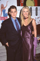 Michael Buble in blue suit with Maeve Quinlan in purple dress at 'Totally Blonde' premiere photo print.