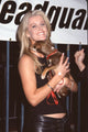 Maeve Quinlan holding a puppy at the Animal Avengers party photo print.