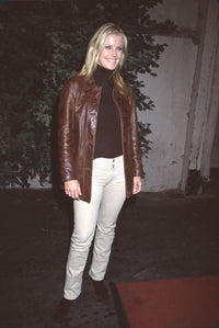 Maeve Quinlan in tan pants and brown leather jacket photo print