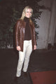 Maeve Quinlan in tan pants and brown leather jacket photo print