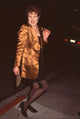 Lynn Redgrave in black mini dress with copper blazer photo print.