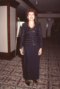Lynn Redgrave in black long skirt and satin striped top at Genesis Awards photo print.