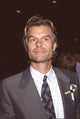 Harry Hamlin in gray suit with yellow ribbon pin photo print