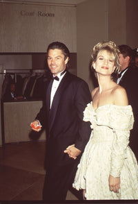 Harry Hamlin in tuxedo with Nicollette Sheridan in off-shoulder white dress photo print