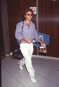 Harry Hamlin posing in white pants and sunglasses at LAX photo print.