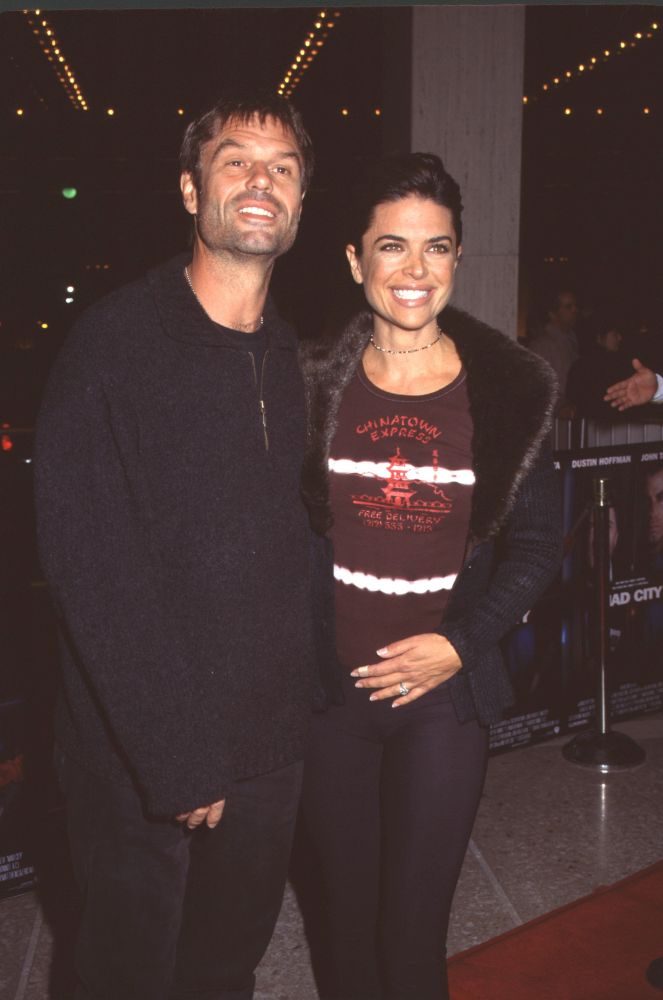 Harry Hamlin in suit with Lisa Rinna in fur-collared jacket at Mad City premiere photo print.