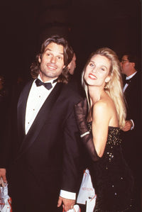 Harry Hamlin in tuxedo and Nicollette Sheridan in black dress photo print.