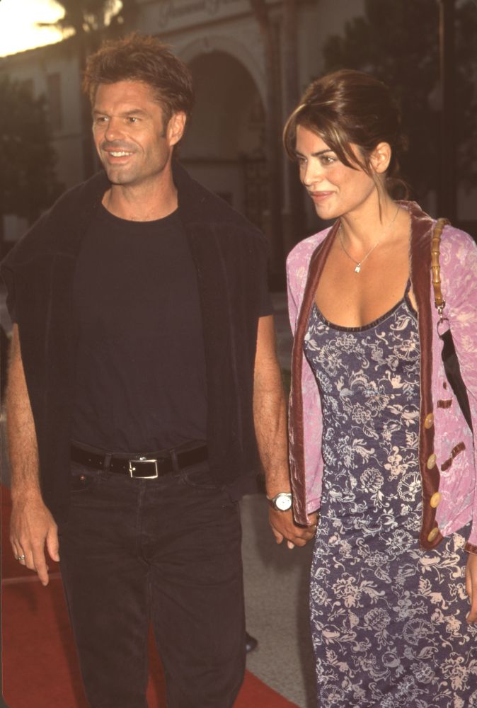 Photo print of Harry Hamlin in black outfit and Lisa Rinna in paisley dress with pink jacket