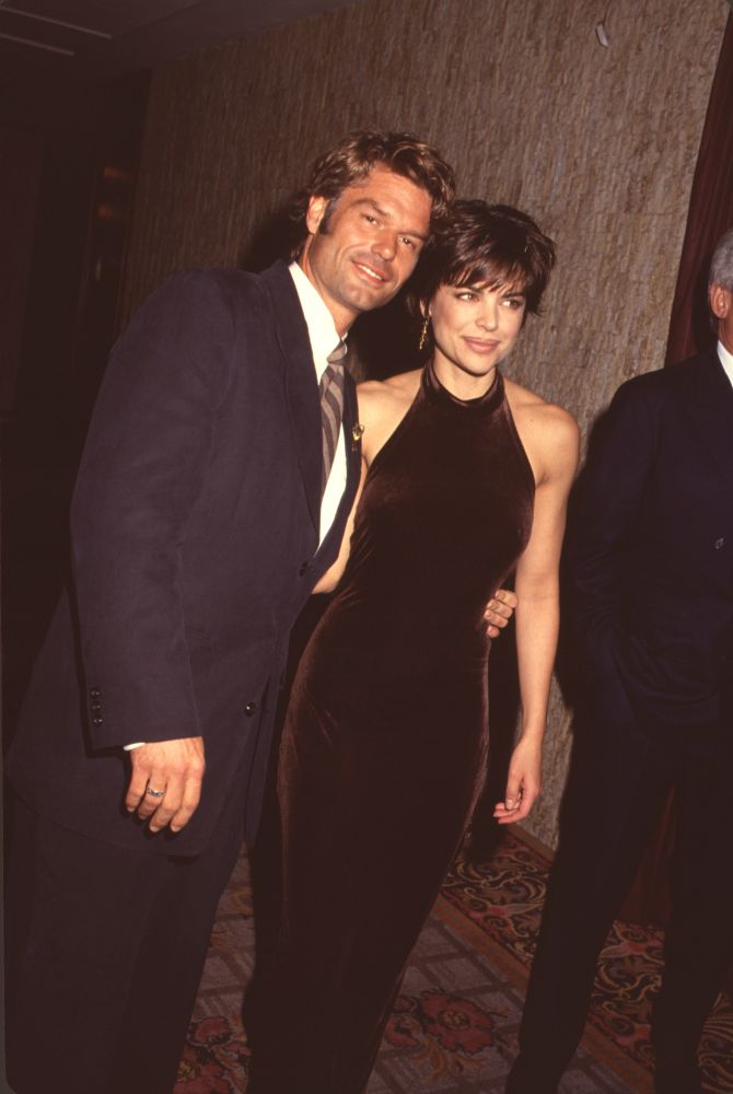 Harry Hamlin in suit and Lisa Rinna in brown velvet halter dress photo print.