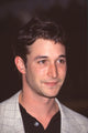 Close-up photo print of Noah Wyle in a checkered tan blazer at NBC press tour party