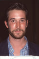 Close-up photo print of Noah Wyle in a blue plaid shirt