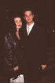 Julianna Margulies in leather jacket with Noah Wyle in suit at La Free Clinic Benefit photo print
