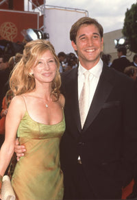 Tracy Warbin in green dress with Noah Wyle at the 49th Emmy Awards photo print