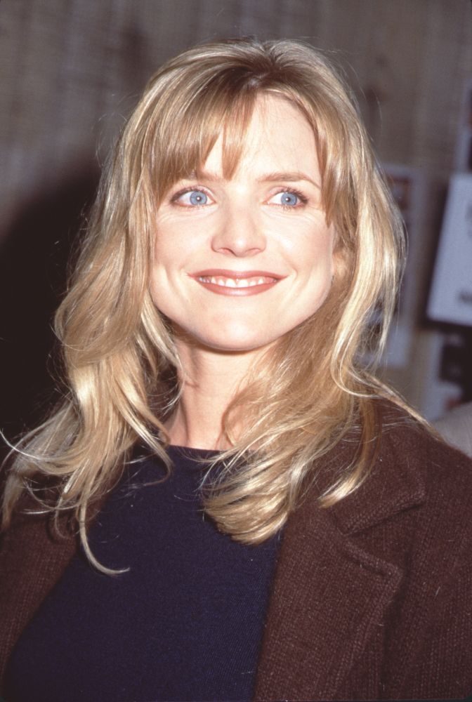 Courtney Thorne-Smith close-up photo print in brown jacket.