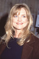 Courtney Thorne-Smith close-up photo print in brown jacket.