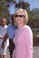 Courtney Thorne Smith closeup photo print in pink cardigan and sunglasses.