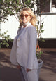 Courtney Thorne Smith photo print in white suit and sunglasses.