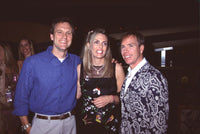 Photo print of John Sykes, Nancy Davis & Tommy Hilfiger at Rock to Erase MS party.