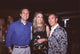 Photo print of John Sykes, Nancy Davis & Tommy Hilfiger at Rock to Erase MS party.