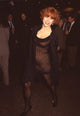 Jennifer Tilly in black tights and lace mini dress at 'Wrestling Ernest Hemingway' screening.