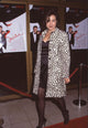 Jennifer Tilly in elegant black dress and spotted coat at Sabrina premiere photo print.
