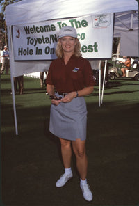 Mary Hart in dark red top and gray skirt at the Nabisco Championship photo print.