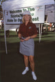 Mary Hart in dark red top and gray skirt at the Nabisco Championship photo print.