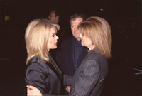 Mary Hart and Arianna Huffington hugging at S. Weitzman on Rodeo Drive photo print