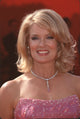 Mary Hart in strapless pink gown with teardrop diamond necklace at the Academy Awards.