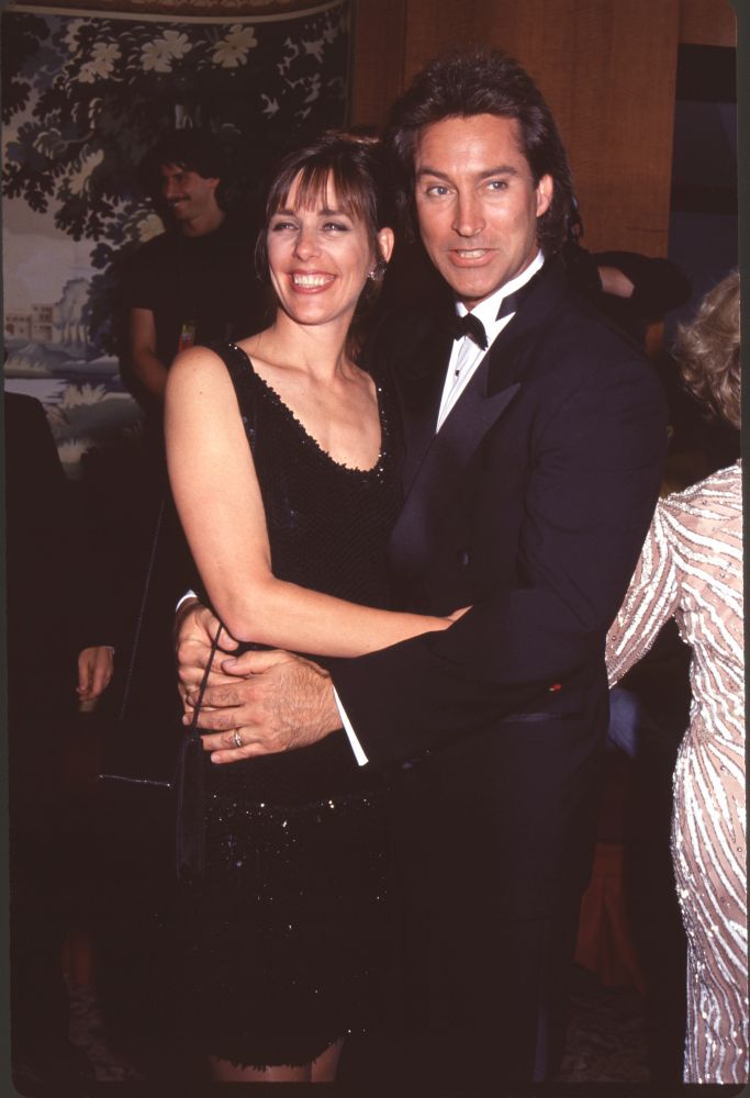 Victoria Price in black sparkle dress and Drake Hogestyn in tuxedo photo print.