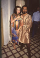 Hunter Tylo holding a snake with Kabir Bedi on the set of Bold & Beautiful photo print